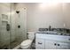 Modern bathroom featuring a tiled shower, sleek vanity with granite countertop, and contemporary fixtures at 110 Emmaline Ct, Troutman, NC 28166