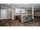 Living area with wet bar and hardwood floors, open floor plan at 110 Emmaline Ct, Troutman, NC 28166