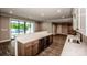 Living area with wet bar, open floor plan, and view of the pool at 110 Emmaline Ct, Troutman, NC 28166