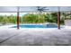 View of pool with hot tub and landscaped backyard at 110 Emmaline Ct, Troutman, NC 28166