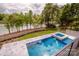 An aerial view of the pool and hot tub looking toward the lake at 110 Emmaline Ct, Troutman, NC 28166