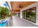 Stunning outdoor porch and pool offer an amazing place to relax and enjoy the water view at 110 Emmaline Ct, Troutman, NC 28166