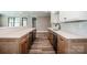 Basement bar area features wood cabinets, stainless steel appliances, and white countertops at 116 Emmaline Ct, Troutman, NC 28166