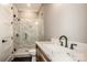 Modern bathroom featuring white marble shower and sink, and dark bronze hardware at 116 Emmaline Ct, Troutman, NC 28166