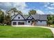 Charming two-story home featuring a well-manicured lawn and three-car garage at 116 Emmaline Ct, Troutman, NC 28166