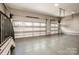 Spacious three car garage with windows and epoxy floor at 116 Emmaline Ct, Troutman, NC 28166