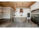 Bright kitchen featuring white cabinets, a wood island, stainless steel appliances, and wood ceiling at 116 Emmaline Ct, Troutman, NC 28166