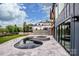 Beautiful pool and hot tub with modern tile work and lake view at 116 Emmaline Ct, Troutman, NC 28166