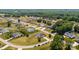 The suburban neighborhood has well-manicured lawns, mature trees, and a variety of single-Gathering homes at 104 Castle Pines Ln, Statesville, NC 28625