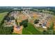 A well-planned residential area, featuring newly constructed homes and green spaces, near existing houses with pools at 104 Castle Pines Ln, Statesville, NC 28625