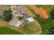 A community pool and clubhouse with lush landscaping and ample parking, near picturesque homes at 104 Castle Pines Ln, Statesville, NC 28625