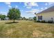 Expansive backyard view shows landscaping and community at 104 Castle Pines Ln, Statesville, NC 28625