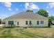 Exterior back shows the house with patio and well-manicured lawn at 104 Castle Pines Ln, Statesville, NC 28625
