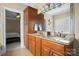 Bathroom with double vanity, granite countertops, and ample cabinet space at 104 Castle Pines Ln, Statesville, NC 28625