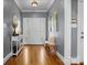 Elegant entryway with hardwood floors, bench, and stylish decor at 104 Castle Pines Ln, Statesville, NC 28625