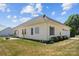 Exterior shows home with attached garage, patio and landscaping at 104 Castle Pines Ln, Statesville, NC 28625