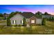 Charming single-story home featuring manicured lawn, stone accents and a cozy, inviting appeal at 104 Castle Pines Ln, Statesville, NC 28625