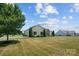 Well-manicured lawn and landscaping highlight this single Gathering home with great curb appeal at 104 Castle Pines Ln, Statesville, NC 28625