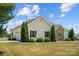 A well-maintained home with mature evergreens and large yard gives a sense of pride of ownership at 104 Castle Pines Ln, Statesville, NC 28625