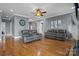 Comfortable living room featuring hardwood floors, recessed lighting, and modern decor at 104 Castle Pines Ln, Statesville, NC 28625