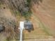 An aerial view of a home and surrounding farmland, driveway, and landscaping at 8255 W Nc 10 Hwy, Vale, NC 28168