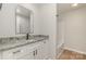 Well lit bathroom featuring granite counters, white cabinets and black hardware at 8255 W Nc 10 Hwy, Vale, NC 28168