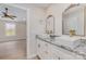 Stylish bathroom with dual sinks, granite countertops, gold fixtures, and plenty of vanity storage at 8255 W Nc 10 Hwy, Vale, NC 28168