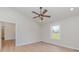 Bright bedroom with modern ceiling fan, white trim, and a view of the surrounding landscape at 8255 W Nc 10 Hwy, Vale, NC 28168