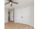 Neutral bedroom with wood-look flooring and a ceiling fan plus large double closets at 8255 W Nc 10 Hwy, Vale, NC 28168