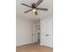 Neutral bedroom with wood-look flooring and a ceiling fan plus white doors at 8255 W Nc 10 Hwy, Vale, NC 28168