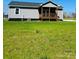 Daytime exterior of home showing the siding, porch, and green grass at 8255 W Nc 10 Hwy, Vale, NC 28168