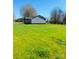 Charming exterior of a single-Gathering home with an expansive green lawn and a view of the surrounding landscape at 8255 W Nc 10 Hwy, Vale, NC 28168