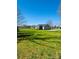 Single-story home situated on a large lot with a green lawn under a blue sky at 8255 W Nc 10 Hwy, Vale, NC 28168