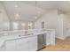 Bright kitchen with white cabinets, stainless steel appliances, breakfast bar, and modern pendant lighting at 8255 W Nc 10 Hwy, Vale, NC 28168