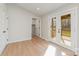 Bright, airy living room with hardwood floors, French doors to deck, and neutral walls at 8255 W Nc 10 Hwy, Vale, NC 28168
