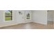 A bright living room featuring new floors, natural light from windows, and fresh, neutral paint at 8255 W Nc 10 Hwy, Vale, NC 28168