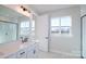 Bright bathroom showcasing a double sink vanity, black fixtures and a window with a view of the landscape at 133 Armstrong Rd, Belmont, NC 28012