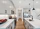 Modern kitchen featuring sleek countertops, stainless steel appliances, a spacious island, and custom cabinetry at 133 Armstrong Rd, Belmont, NC 28012