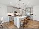 Stylish kitchen features a center island with seating, stainless appliances, and modern cabinets with accent lighting at 133 Armstrong Rd, Belmont, NC 28012