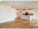 Spacious open-concept boasts hardwood floors and a seamlessly integrated kitchen with a large center island at 133 Armstrong Rd, Belmont, NC 28012