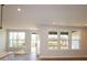 Bright living room with hardwood floors, large windows and glass door for access to the outdoor patio at 133 Armstrong Rd, Belmont, NC 28012