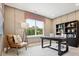 Home office featuring paneled walls, a large window with natural light, and dark wood furniture at 133 Armstrong Rd, Belmont, NC 28012