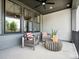 Outdoor patio with modern chairs and table, perfect for relaxing with views of the landscaped yard at 133 Armstrong Rd, Belmont, NC 28012