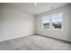 Bright bedroom with carpet and large window at 108 Brooke Forest Ct, Mooresville, NC 28115