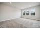 Comfortable bedroom with carpeted floor and large windows at 108 Brooke Forest Ct, Mooresville, NC 28115