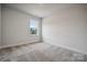 Simple bedroom with carpet and a window at 108 Brooke Forest Ct, Mooresville, NC 28115