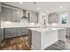 Modern kitchen with gray cabinets, white countertops, and stainless steel appliances at 108 Brooke Forest Ct, Mooresville, NC 28115
