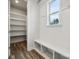 Spacious pantry with white shelves and wood flooring at 108 Brooke Forest Ct, Mooresville, NC 28115