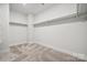 Spacious walk-in closet with built-in shelves at 108 Brooke Forest Ct, Mooresville, NC 28115