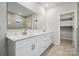 Spacious bathroom featuring double vanity with large mirror and tile flooring at 232 E Warfield Dr, Mooresville, NC 28115